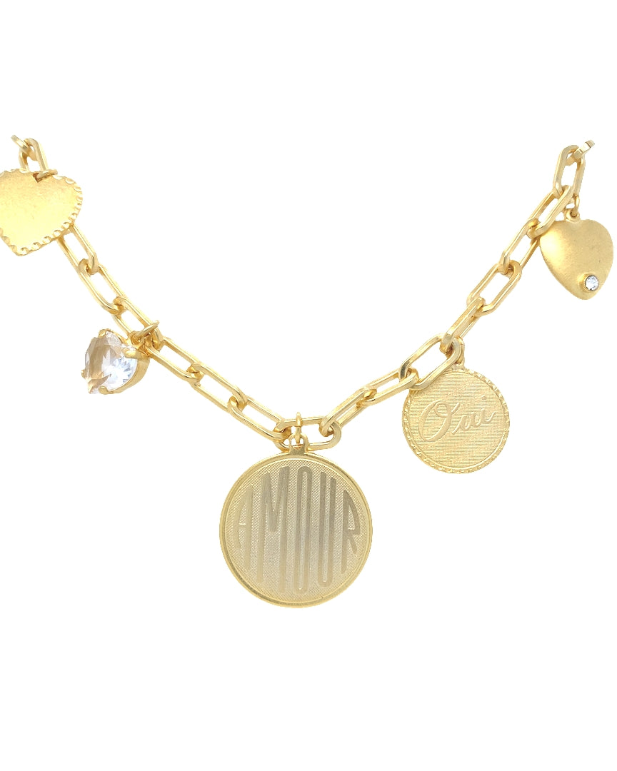 Gold bracelet with various charms on a white background